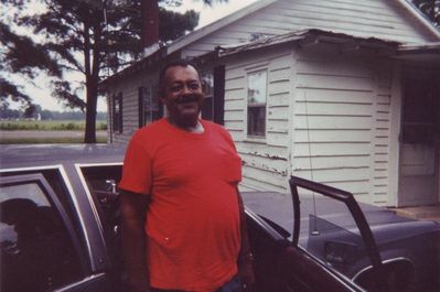 Thornton (Tap) Ray
 2005 Tap takes a picture outside his mother's house in Rich Square, NC
Thornton (Tap) is the son of Alice Mae Harvey Ray
