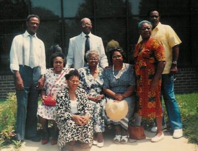 The Baugham Siblings
Standing, l. to r.: Oliver Wendell (Wimpy) Baugham, George (Connie) Baugham, Evelyn Baugham Ward and Morris (Bump) Baugham.
Seated, l. to r.: Ludaine (Jackie) Baugham Rudisill, Flora (Poke) Baugham, Beulah Baugham Melton, and Geraldine Baugham Tann.
These are the children of Mariah F. Harvey Baugham.
