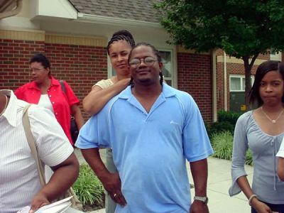 Darryal Anderson & Family
Taken 2003 at the Baugham Family Reunion in Rocky. Mt. NC.
Darryal is the Son of Floria Melton Anderson, the Grandson of Beulah Baugham Melton and the Great Grandson of Mariah (Ra) Harvey Baugham.
Regina Hinton is the Life Partner of Darryal.
Queshia Anderson is the Daughter of Darryal Anderson, the Granddaughter of Floria Melton Anderson, the Great Granddaughter of Beulah Baugham Melton and the Great Great Granddaughter of Mariah Frances (Ra) Harvey Baugham.
